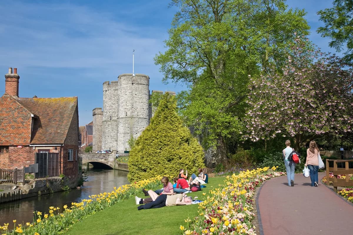 Westgate Gardens and the Westgate Towers seen along the River Stour