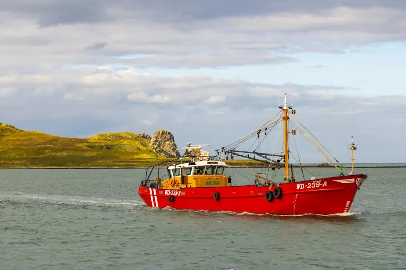 Fishing trawler approaching Ireland's Eye island off Howth Harbour